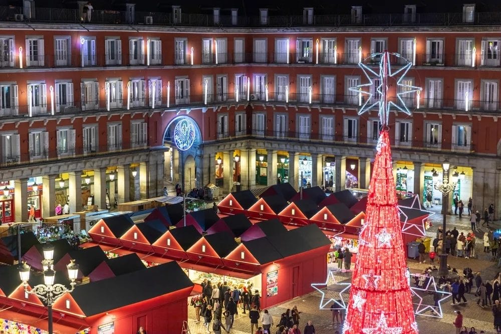 Giant fiberglass Christmas ornaments decorating a city square during the holidays